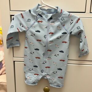 Adorable baby rash guard size 0-3 months brand is Janie & Jack